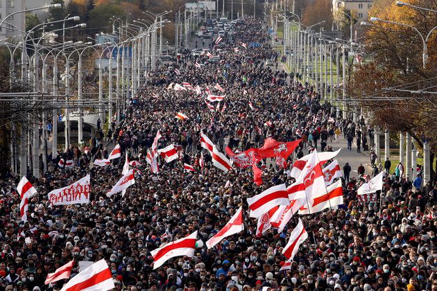 Opposition supporters parade through the streets during a rally to protest against the Belarus presidential election results in Minsk on October, 2020. (Photo: AFP via Getty Images)