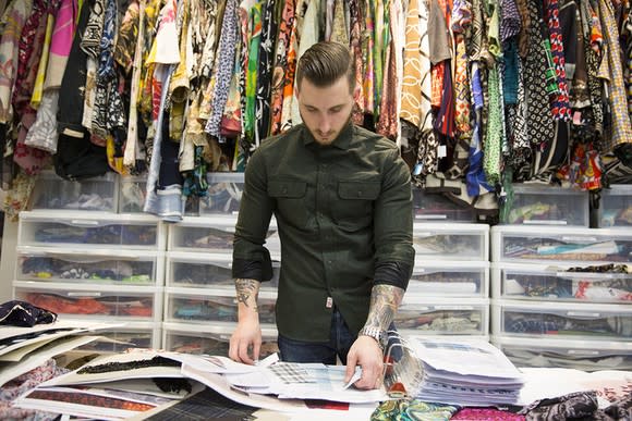 A male designer working in a Banana Republic design studio