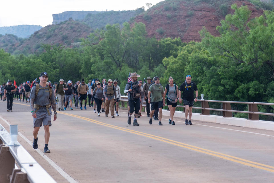Marchers cross a bridge during the Ruck Up Foundation's annual Memorial Day Ruck at Palo Duro Canyon in this 2023 file photo.
