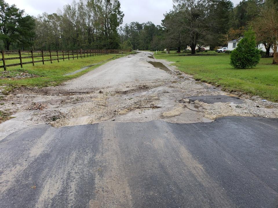 After rain, residents have to deal with poor road conditions on Arvida Spur Road after state maintenance ends.