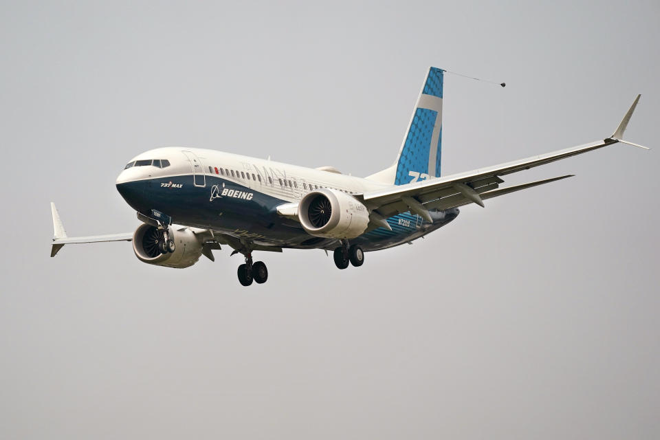 FILE - In this Wednesday, Sept. 30, 2020, file photo, a Boeing 737 Max jet, piloted by Federal Aviation Administration Chief Steve Dickson, prepares to land at Boeing Field following a test flight in Seattle. The FAA is poised to clear the Boeing 737 Max to fly again after grounding the jets for nearly two years due to a pair of disastrous crashes that killed 346 people. (AP Photo/Elaine Thompson, File)