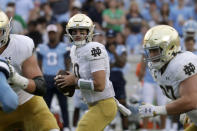 Notre Dame quarterback Drew Pyne (10) looks to pass during the second half of an NCAA college football game against North Carolina in Chapel Hill, N.C., Saturday, Sept. 24, 2022 (AP Photo/Chris Seward)