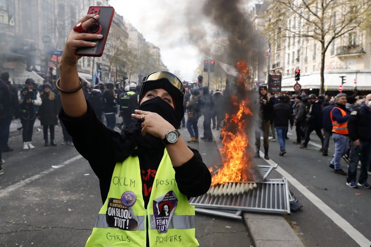 A protester in Paris on Thursday (EPA)