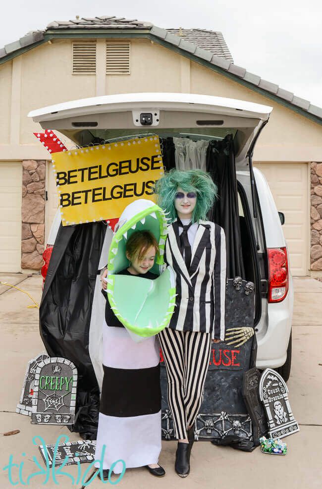 <p>There's a lot going on in the afterlife as envisioned by <em>Beetlejuice</em>, which makes for great trunk-or-treat fodder. In this display, black and white tablecloths make for the striped backdrop, and flashing <a href="https://www.amazon.com/gp/product/B07G12YMMM?tag=syn-yahoo-20&ascsubtag=%5Bartid%7C10055.g.28747729%5Bsrc%7Cyahoo-us" rel="nofollow noopener" target="_blank" data-ylk="slk:LED globe lights;elm:context_link;itc:0;sec:content-canvas" class="link ">LED globe lights</a> even illuminate the sign at night.</p><p><a href="https://tikkido.com/blog/Beetlejuice-Trunk-or-Treat" rel="nofollow noopener" target="_blank" data-ylk="slk:See more at Tikkido »;elm:context_link;itc:0;sec:content-canvas" class="link "><em>See more at Tikkido »</em></a></p>