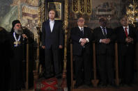 <p>Russian President Vladimir Putin, second left, and Greek Foreign Minister Nikos Kotzia, center, visit the church of the Protaton, dedicated to the Dormition of the Virgin, in Karyes, the administrative center of the all-male Orthodox monastic community of Mount Athos, northern Greece, May 28, 2016. Putin has arrived at the northern Greek peninsula of Mount Athos, on a visit to the autonomous Orthodox Christian monastic community. (Alexandros Avramidis/Pool Photo via AP) </p>