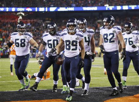 Seattle Seahawks wide receiver Jermaine Kearse (15) runs with the ball on  the way to a 23 yard touchdown against the Denver Broncos at the Super Bowl  XLVIII at MetLife Stadium in