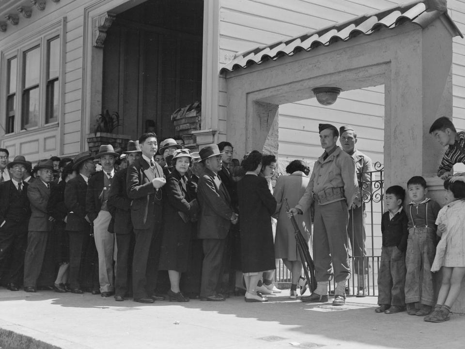 apanese family heads and persons living alone, form a line outside Civil Control Station located in the Japanese American Citizens League Auditorium at 2031 Bush Street, to appear for "processing" in response to Civilian Exclusion Order Number 20.