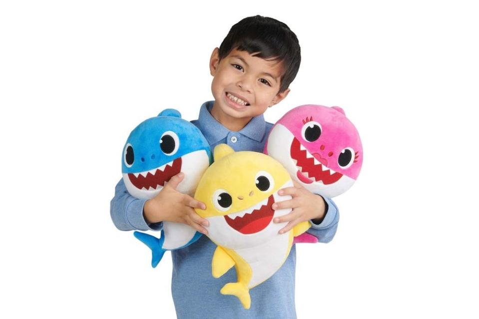 Child with WowWee Pinkfong Baby Shark Official Song Dolls