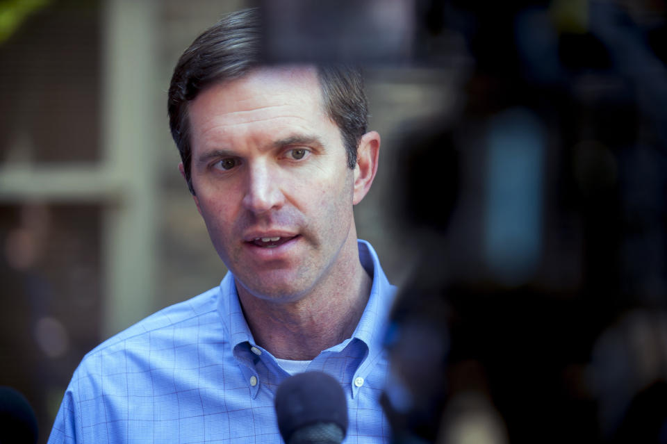 Kentucky attorney general and Democratic gubernatorial candidate Andy Beshear talks with reporters during a campaign stop at Spencer's Coffee, Friday, May 17, 2019 in Bowling Green, Ky. (Bac Totrong/Daily News via AP)