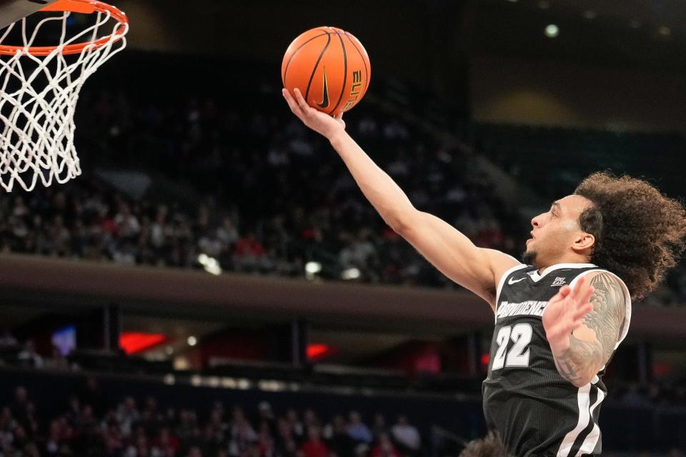 Providence guard Devin Carter goes in for a layup during Saturday's game against St. John's.