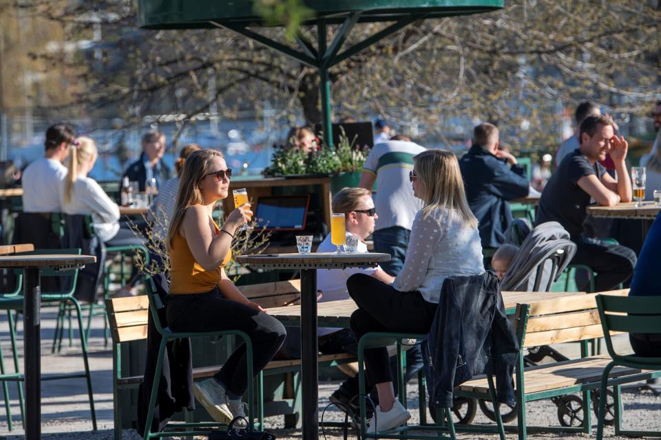 People socialize and enjoy the spring, as the coronavirus disease (COVID 19) outbreak continues, in Stockholm, Sweden, April 22, 2020..JPG