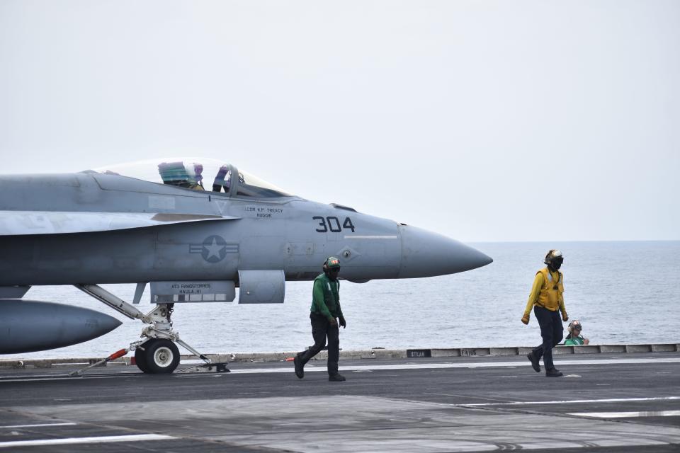 A fighter jet prepares for takeoff on the USS Dwight D. Eisenhower.