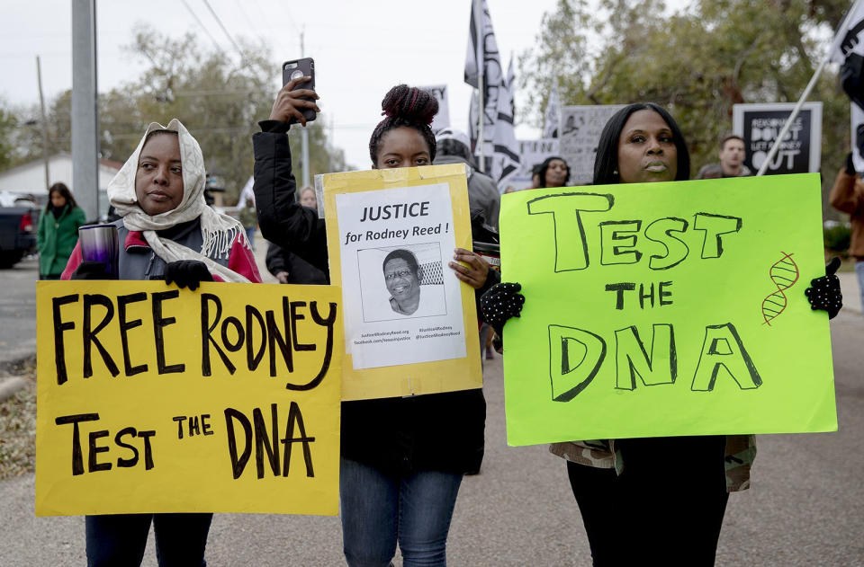 Women march with signs during a protest against the execution of Rodney Reed on Wednesday, Nov. 13, 2019, in Bastrop, Texas. Protesters rallied in support of Reed’s campaign to stop his scheduled Nov. 20 execution for the 1996 killing of a 19-year-old Stacy Stites. New evidence in the case has led a growing number of Texas legislators, religious leaders and celebrities to press Gov. Greg Abbott to intervene. (Nick Wagner/Austin American-Statesman via AP)