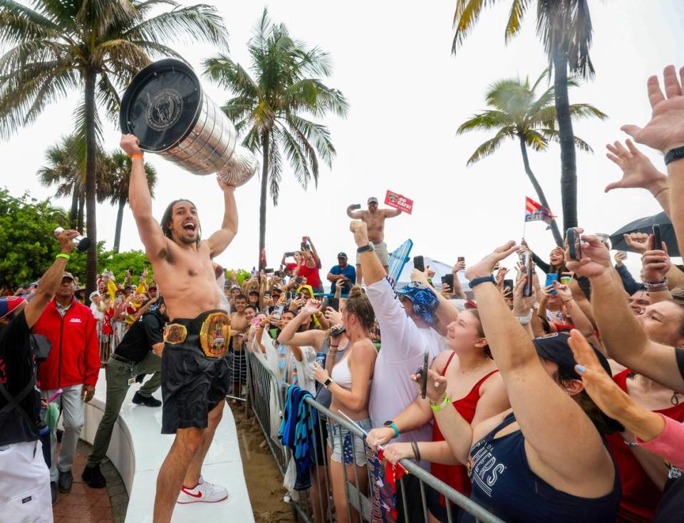 Florida Panthers left wing Ryan Lomberg lifts the Stanley Cup as fans cheers during the Florida Panthers victory parade before the Stanley Cup victory parade at Fort Lauderdale Beach on Tuesday, June 30, 2024 in Fort Lauderdale. 