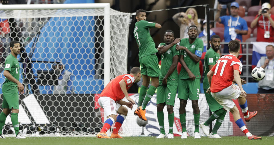 <p>Russia’s Alexander Golovin , right, scores his side’s fifth goal during the group A match between Russia and Saudi Arabia which opens the 2018 soccer World Cup at the Luzhniki stadium in Moscow, Russia, Thursday, June 14, 2018. (AP Photo/Matthias Schrader) </p>