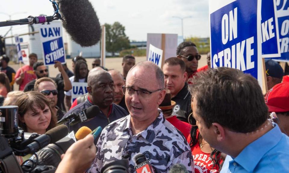 Shawn Fain speaks to the press as UAW members strike in Center Line, Michigan, last week.