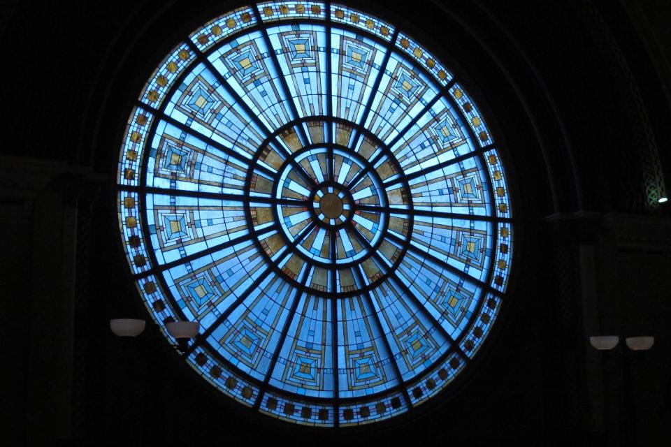 A large stained glass window that illuminates Indianapolis' historic Union Station is shownon Thursday, Oct. 31, 2013, photo taken during the National Preservation Conference. That meeting is bringing together preservation experts from around the nation who are toasting some of the success stories that saving historic sites can bring to communities by revitalizing history-filled neighborhoods and city centers and attracting tourists. About 2,000 preservation experts were expected to attend the 5-day gathering, which ends Saturday. (AP Photo/Rick Callahan)