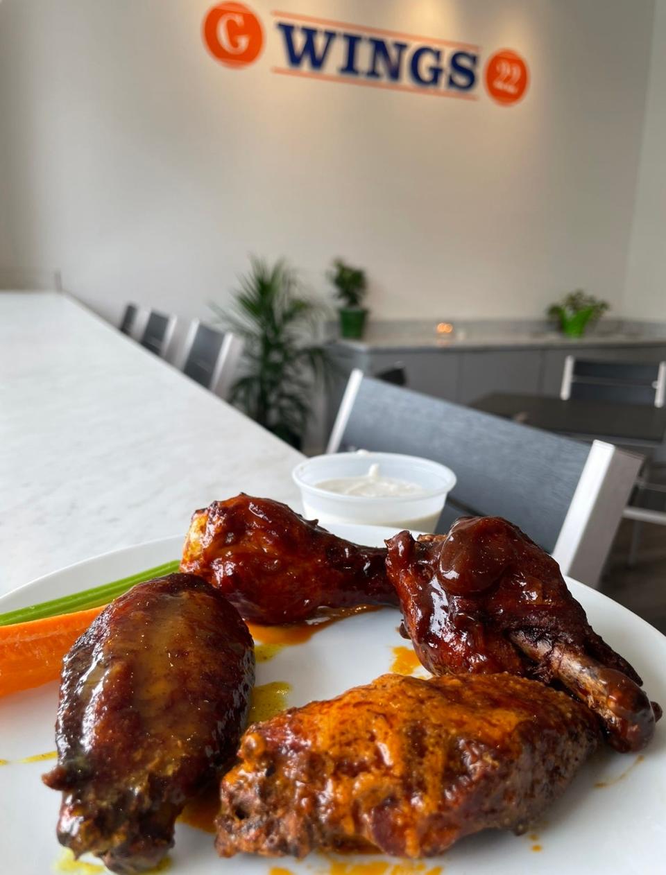 Wings from G Wings 22 in West Long Branch come in four different flavors: Buffalo (clockwise from front), honey mustard, honey sriracha and barbecue.