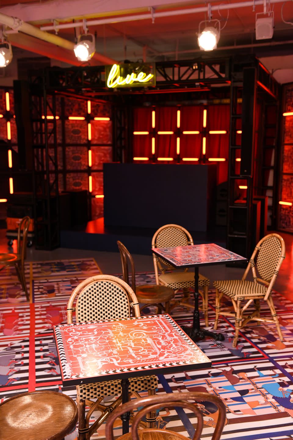 The floors and tables in the cafè are painted in Hermès scarf prints.