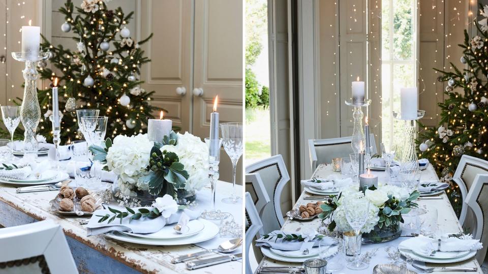 Christmas dining table with white table cloth and silver tableware with white flower Christmas centeroiece idea