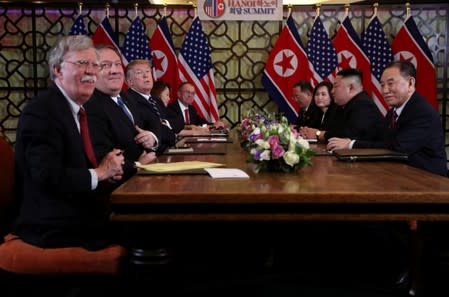 FILE PHOTO: North Korea's leader Kim Jong Un and U.S. President Donald Trump attend the extended bilateral meeting in the Metropole hotel during the second North Korea-U.S. summit in Hanoi