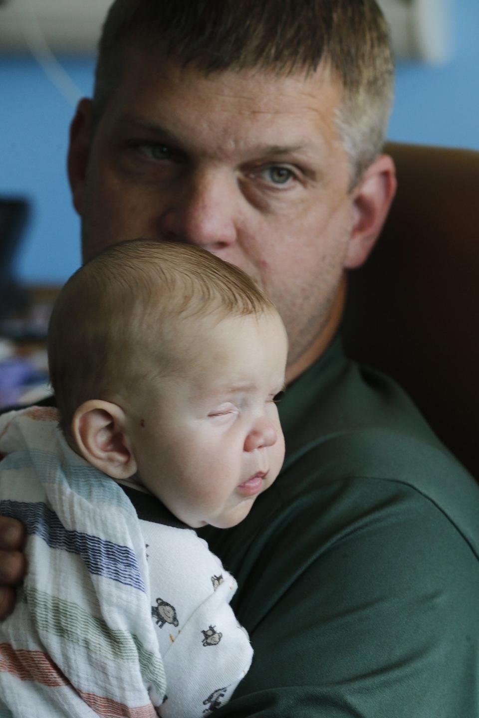 Brad Detwiler holds his son, David. (Karen Schiely)
