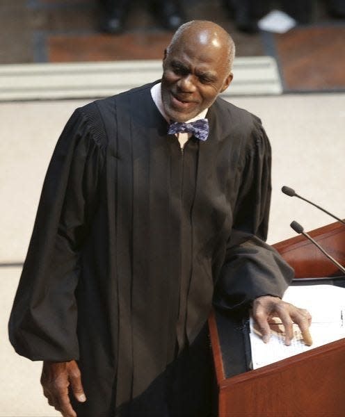 Hon. Alan Page was the Martin Luther King Jr. Memorial Breakfast keynote speaker in 2000. (AP Photo/Jim Mone)