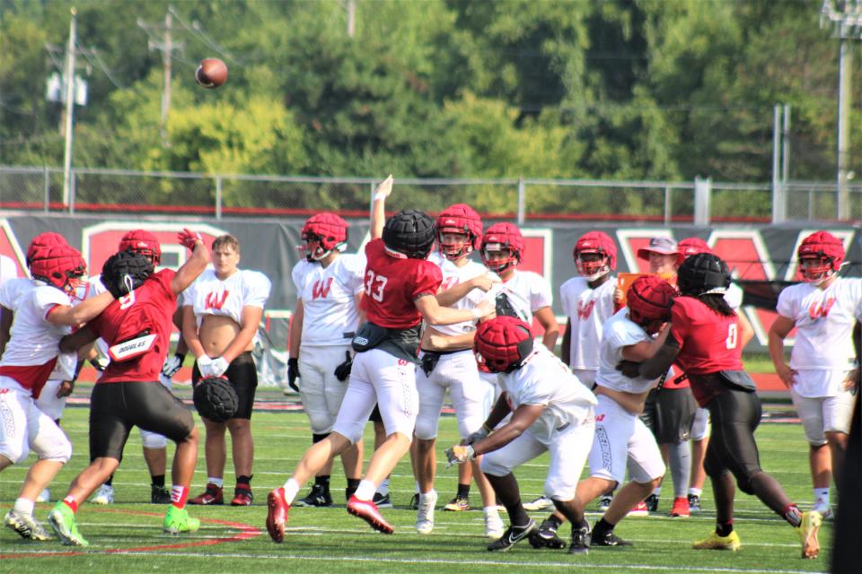 A Firebird QB throws a pass. Lakota West High School football practice, August 2, 2023.