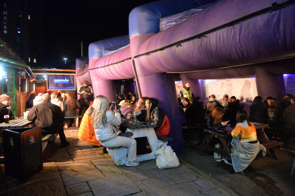 The dedicated patrons of The Oak Inn in Coventry enjoy their first post-lockdown pints and other alcoholic beverages moments after midnight as restrictions across the UK are partially eased. The establishment is licensed till 6am, and also plans to sell food throughout the night, such as pizzas, burgers and kebabs. April 12 2021.
