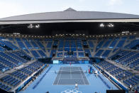 Novak Djokovic, of Serbia, in the far court, practices at the Ariake Tennis Center ahead of the 2020 Summer Olympics, Wednesday, July 21, 2021, in Tokyo, Japan. (AP Photo/Alex Brandon)