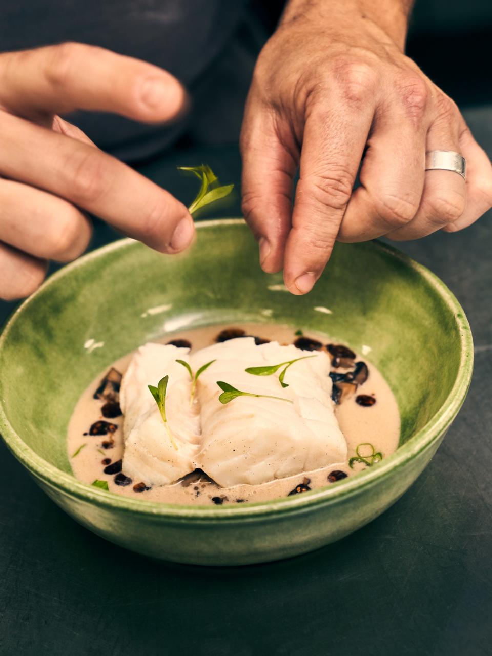 “Tom Kha” Bacalao (coconut, mushrooms, chile oil, crispy rice) at Vianda in San Juan, Puerto Rico.