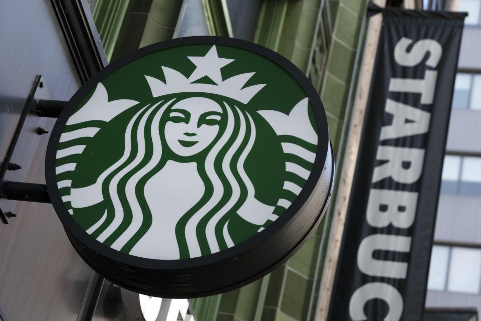 FILE - The Starbucks logo is seen on a storefront on Oct. 14, 2022, in Boston. With U.S. union ranks swelling as everyone from coffee shop baristas to warehouse workers seeks to organize, Illinois voters will decide in November 2022 whether to amend their state constitution to guarantee the right to bargain collectively. (AP Photo/Michael Dwyer, File)