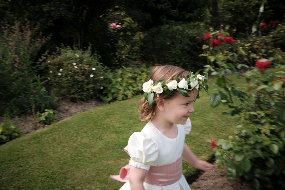One of our flower girls, Leonore, playing among the roses.