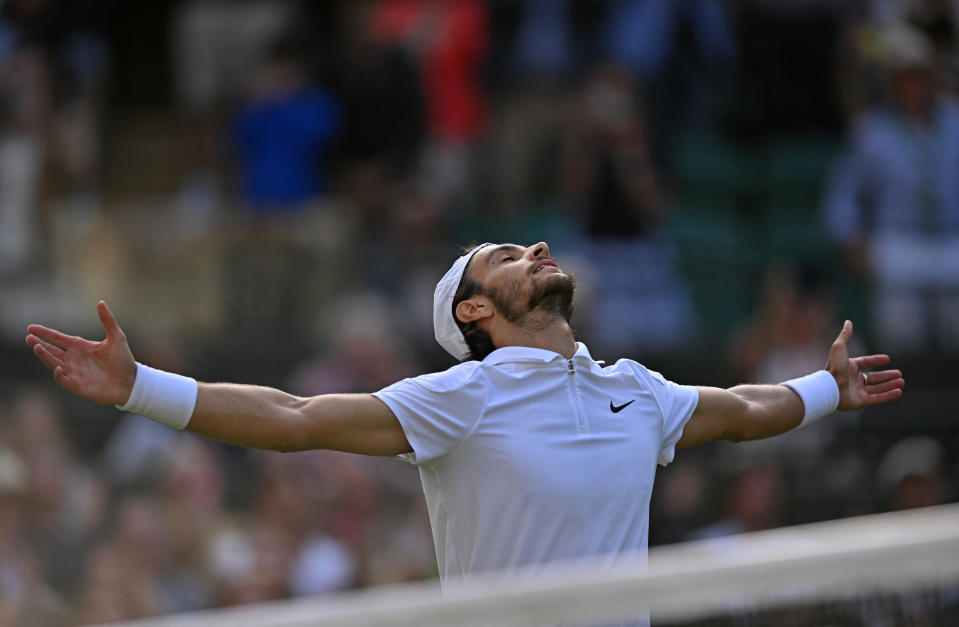 Italy's Lorenzo Musetti celebrates his victory against US player Taylor Fritz during the men's singles quarterfinal match on day ten of the 2024 Wimbledon Championships at the All England Lawn Tennis and Croquet Club in Wimbledon, southwest London on July 10, 2024. Musetti won the match 3-6, 7-6, 6-2, 3-6, 6-1 (Photo by ANDREJ ISAKOVIC / AFP) / EDITORIAL USE ONLY (Photo by ANDREJ ISAKOVIC/AFP via Getty Images)