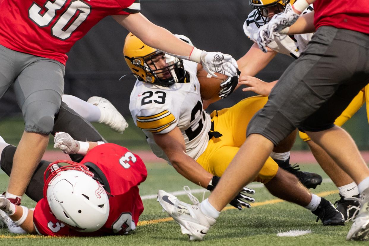 Central Bucks West running back Ryan Clemens crashes through the defense for a touchdown in a 35-14 victory over Upper Dublin.