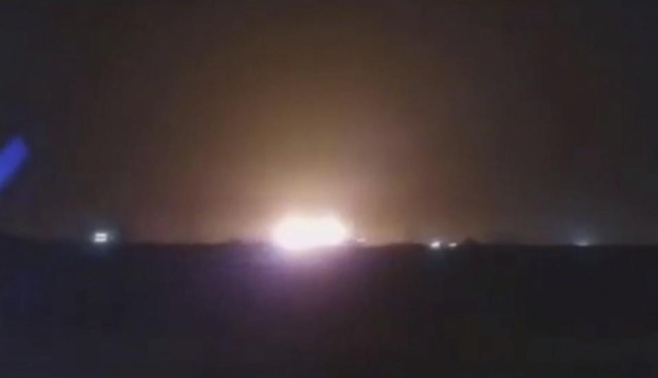 This image taken from a video on Wednesday Jan. 8, 2020 shows a light in the sky which appears to show the Ukrainian jetliner plane on fire and crashing into ground. Western leaders have said the plane appeared to have been unintentionally hit by a surface-to-air missile near Tehran, just hours after Iran launched a series of ballistic missiles at two US bases in Iraq to avenge the killing of its top general in an American airstrike last week. Iran on Friday Jan. 10, 2020, denied the allegations. (UGC via AP)