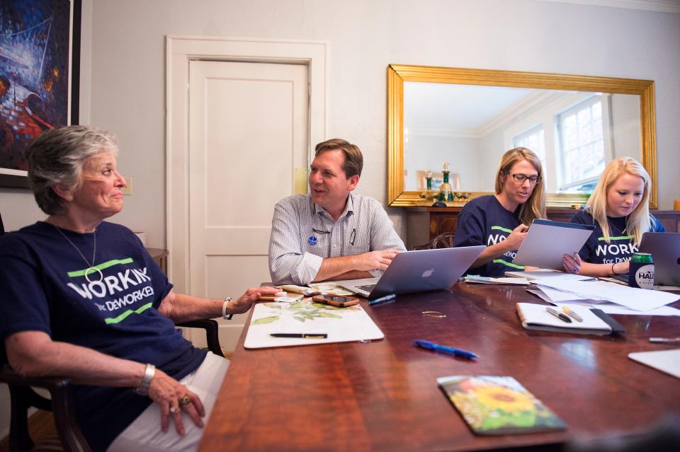 John DeWorken, then a candidate, speaks with his mother-in-law Rebecca Harmon as he and his family spend election day afternoon in their home on Tuesday, Nov. 7, 2017.