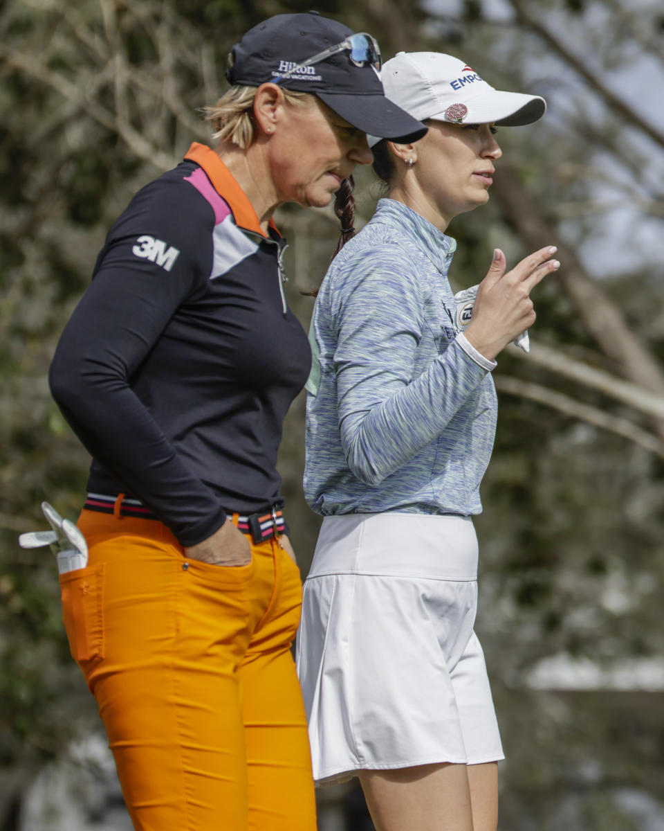 Annika Sorenstam, left, and Cheyenne Knight, right, talk as they walk away from the first tee during the first round of the Hilton Grand Vacations Tournament of Champions LPGA golf tournament in Orlando, Fla., Thursday, Jan. 18, 2024. (AP Photo/Kevin Kolczynski)
