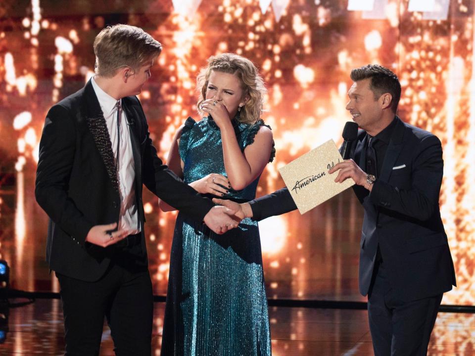 Caleb Lee Hutchinson and Maddie Poppe with Ryan Seacrest on American Idol finale night.