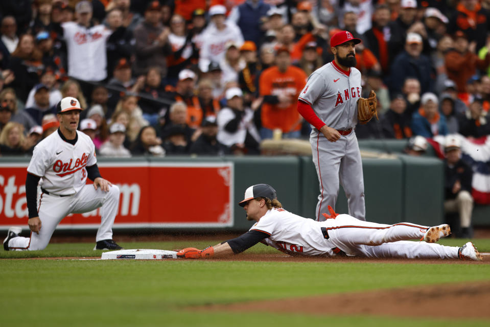 Orioles' Gunnar Henderson (2) dives into third base during the first inning of a baseball game against the Los Angeles Angels, Thursday, March 28, 2024, in Baltimore. (AP Photo/Julia Nikhinson)