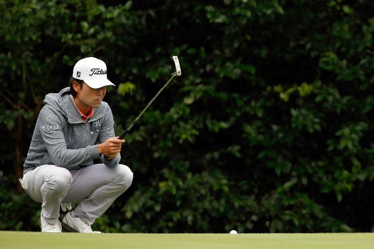 Kevin Na lines up a putt on the 11th hole during the first round of the Crowne Plaza Invitational at the Colonial Country Club on May 21, 2015 in Fort Worth, Texas