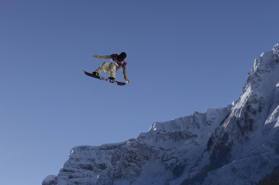 Sage Kotsenburg of the United States takes a jump during a Snowboard Slopestyle training session at the Rosa Khutor Extreme Park, prior to the 2014 Winter Olympics, Tuesday, Feb. 4, 2014, in Krasnaya Polyana, Russia. (AP Photo/Andy Wong)