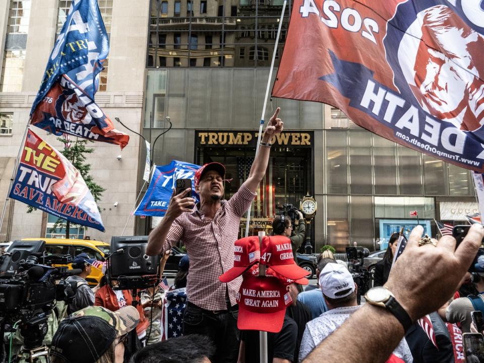 Protesters gather outside Trump Tower in New York City on the day of his conviction (Stephanie Keith/Getty Image)