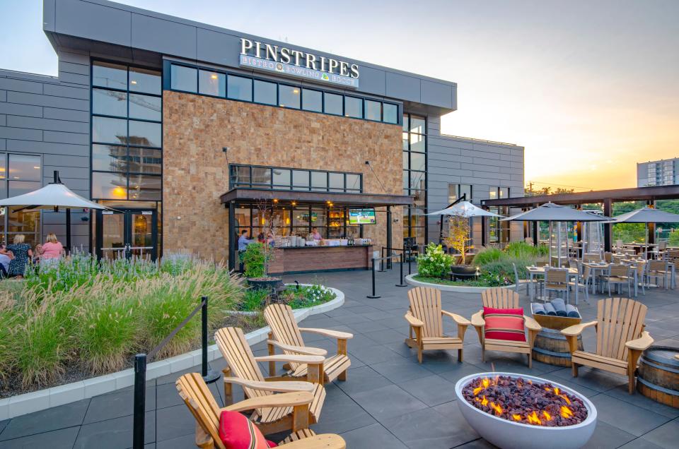 The exterior of Pinstripes, an Italian bistro with bowling lanes and bocce courts, in Bethesda, Maryland.