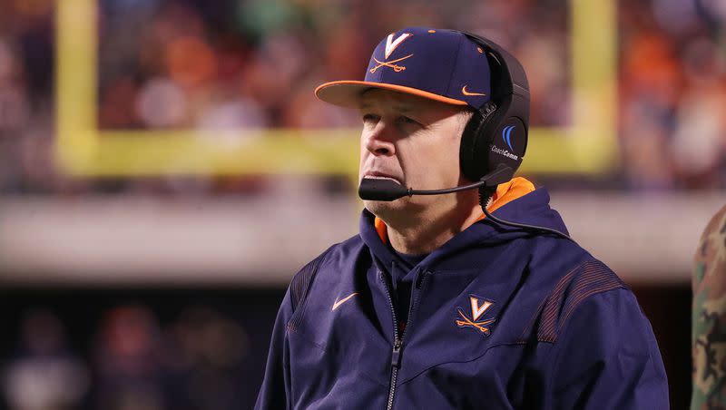 Virginia Cavalier coach Bronco Mendenhall watches a play during a game with Notre Dame in Charlottesville, Va., on Thursday Nov 13, 2021. Mendenhall is stepping down as coach.