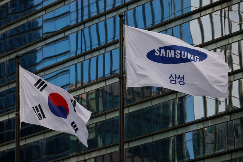 A flag bearing the logo of Samsung flutters in front of its office building in Seoul
