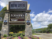 A sign at the entrance to the Foxwoods Resort Casino, in Mashantucket, Conn., announces its reopening, Monday, June 1, 2020. Both tribal casinos, Foxwoods and Mohegan Sun, closed since March 17, opened despite opposition from Connecticut Gov. Ned Lamont, who has limited power regarding the sovereign nations. (AP Photo/Susan Haigh)