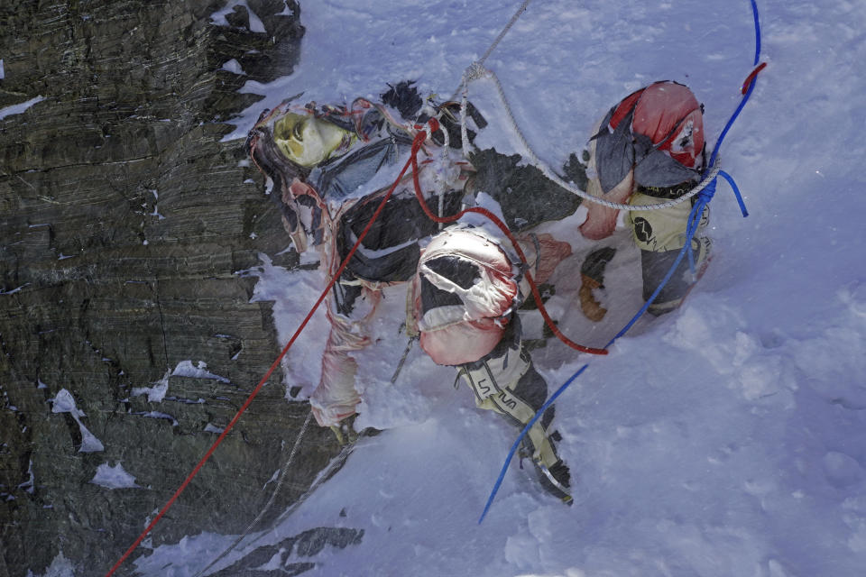 This image provided by the Peak Promotion shows the body of a climber that had been frozen for years before it was removed from the Everest region, Nepal, Monday, May 13, 2024. In the seven decades since Mount Everest was first conquered, thousands of climbers have scaled the peak, and many have left behind more than just their footprints. Tons of trash and several bodies remain on the icy slopes of the world's highest mountain. (Peak Promotion via AP)