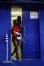 Simone Biles, of the United States, leaves a medical station during the artistic gymnastics women's final at the 2020 Summer Olympics, Tuesday, July 27, 2021, in Tokyo. (AP Photo/Gregory Bull)
