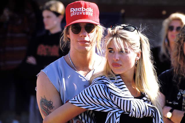 <p>Jeff Kravitz/FilmMagic</p> Jani Lane and Bobbie Brown in 1989